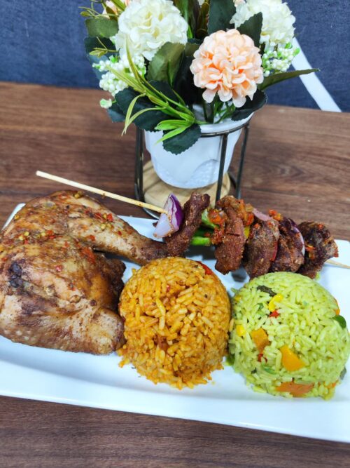 Jollof rice, fried rice, salad and chicken lap